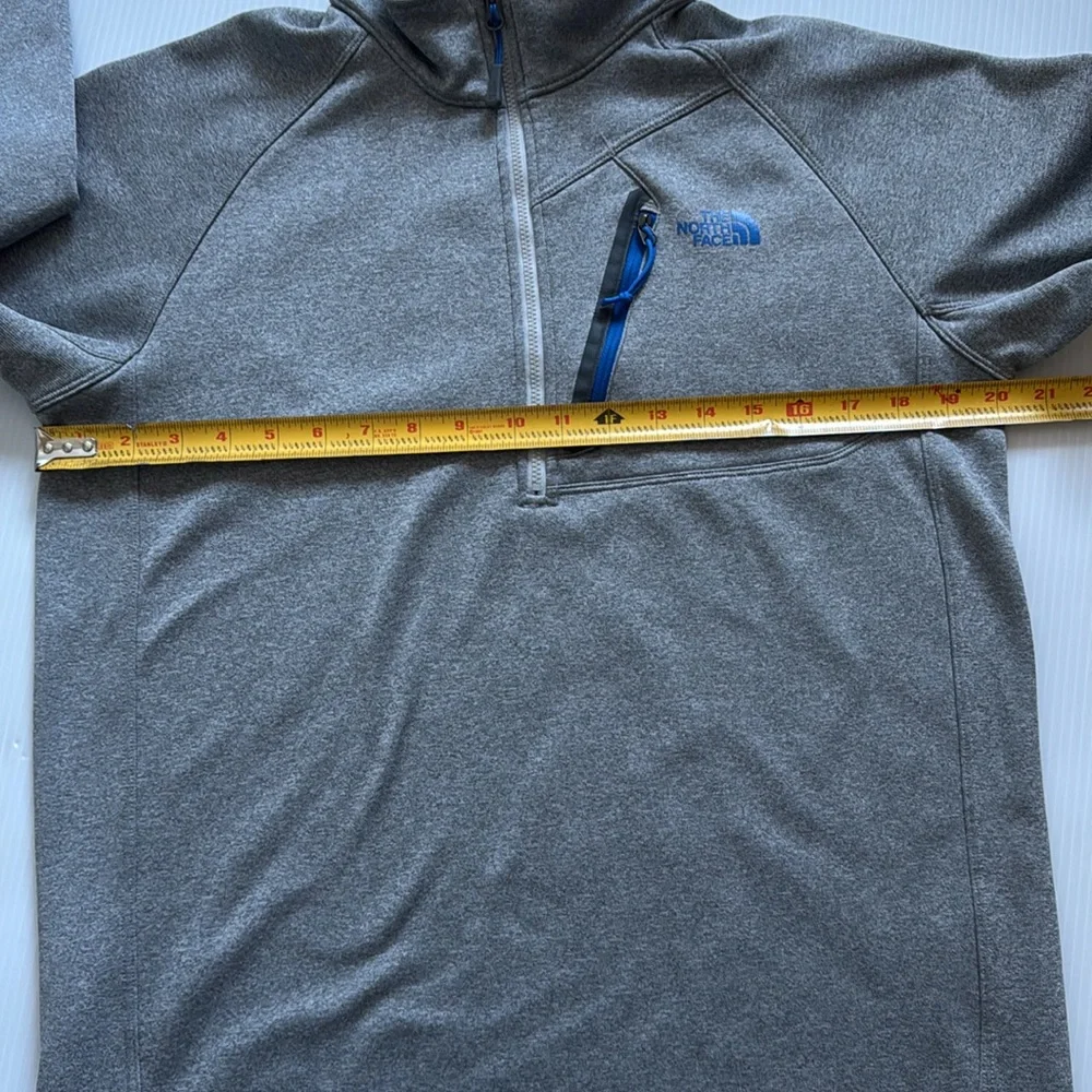 The North Face Men’s gray quarter zip with blue details.  Size medium